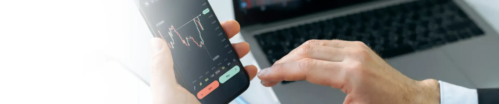 Person on a mobile looking at the stock market
