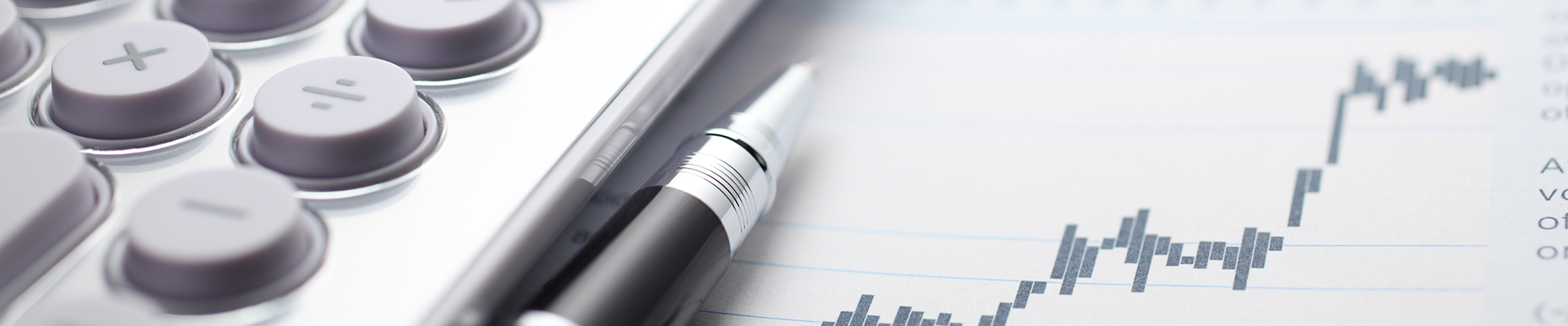 Image of a calculator with a pen and chart