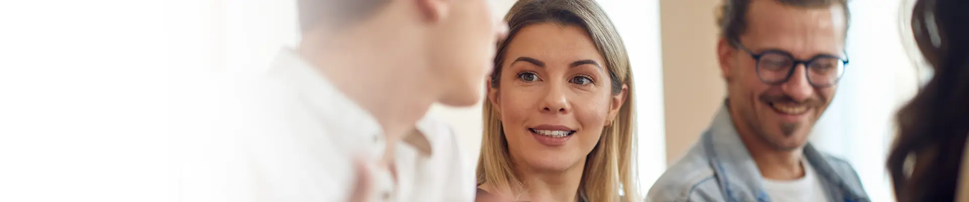 A woman smiling during a business meeting