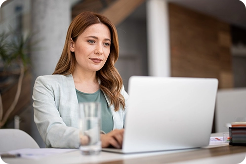 woman working on her computer at the office