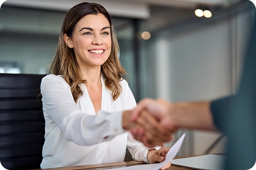 business woman shaking hands with client