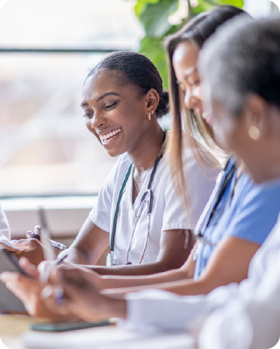 Medical professionals smiling during conversation