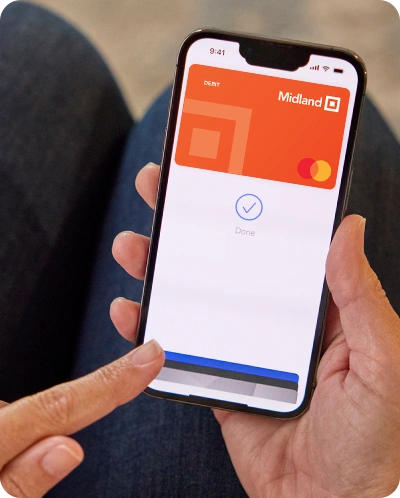 Upclose shot of someone using mobile wallet on their phone