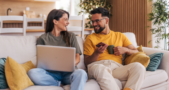 Two people talking on a couch