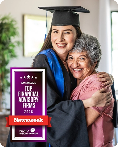 Woman hugging her grandma while wearing her cap and gown with Newsweek award overlaid