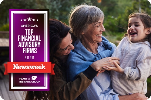 grandmother, mother, and grandchild hugging outside in the yard with Newsweek award overlaid