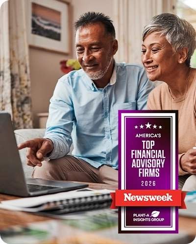 older couple looking at computer with Newsweek award overlaid