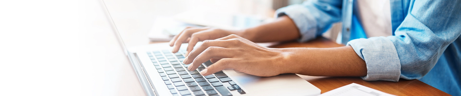 close up shot of person typing on laptop