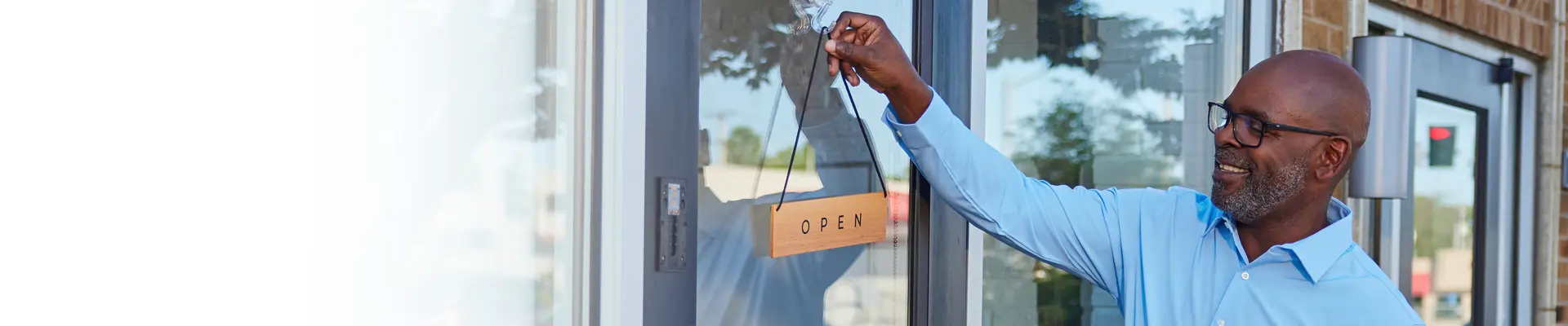 A man opening a store