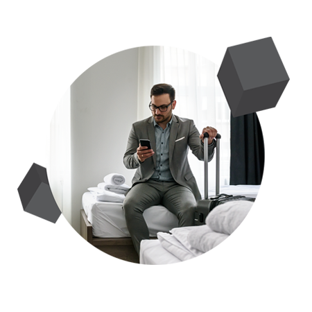a man in a hotel room looking at his phone