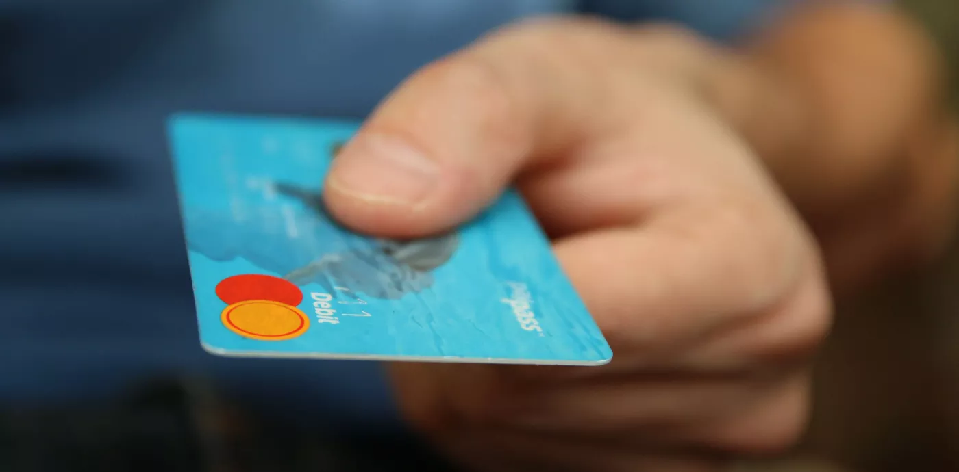 Closeup of hand holding Debit Card