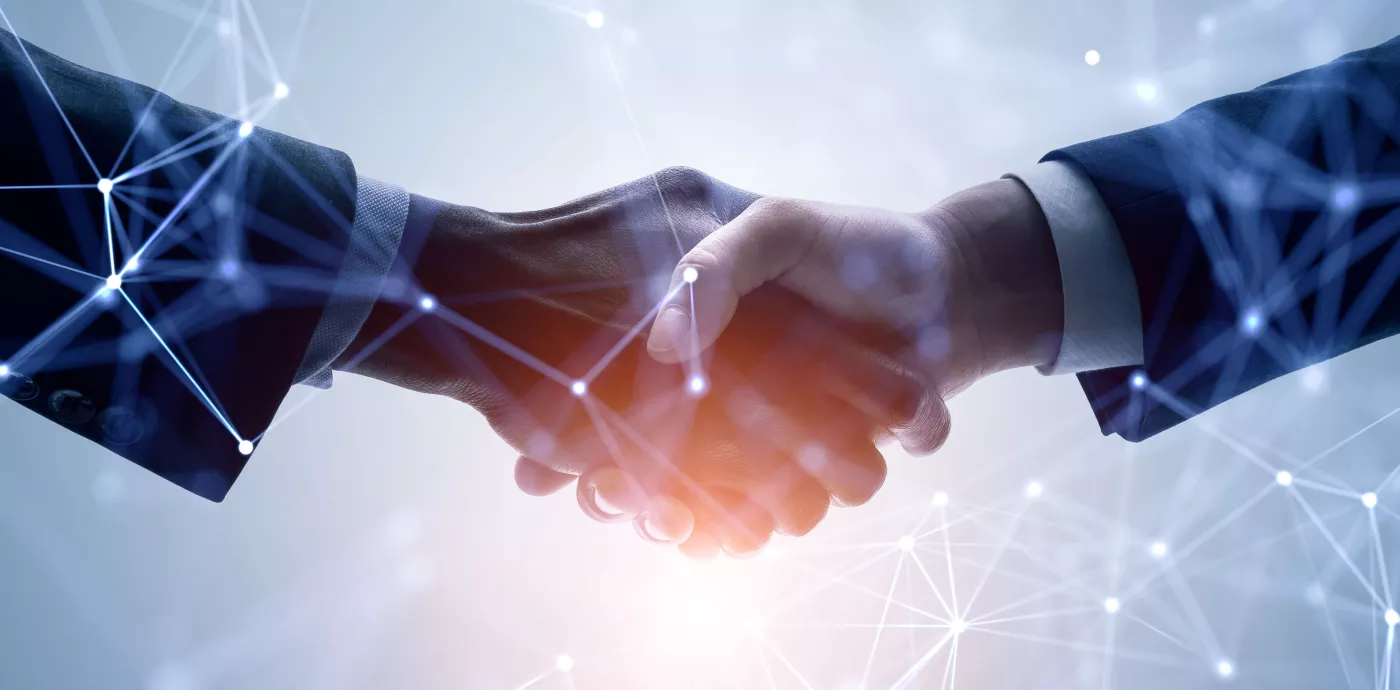 two people shaking hands with abstract overlay showing connection