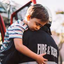 Firefighter caring child