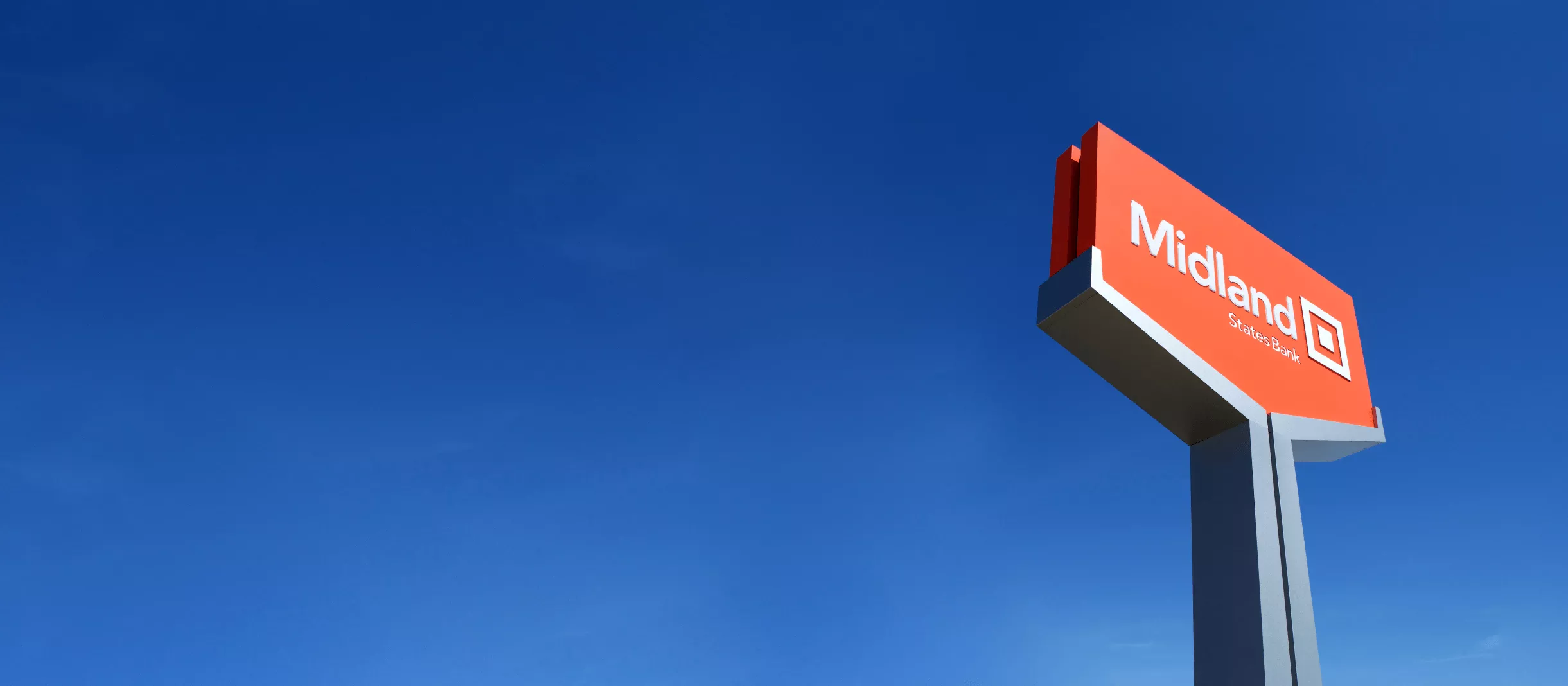 midland bank sign on blue sky