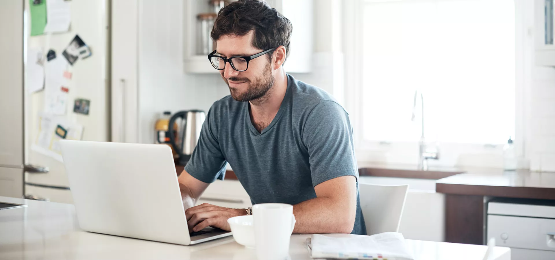 Man using his laptop to research how home improvement loans work