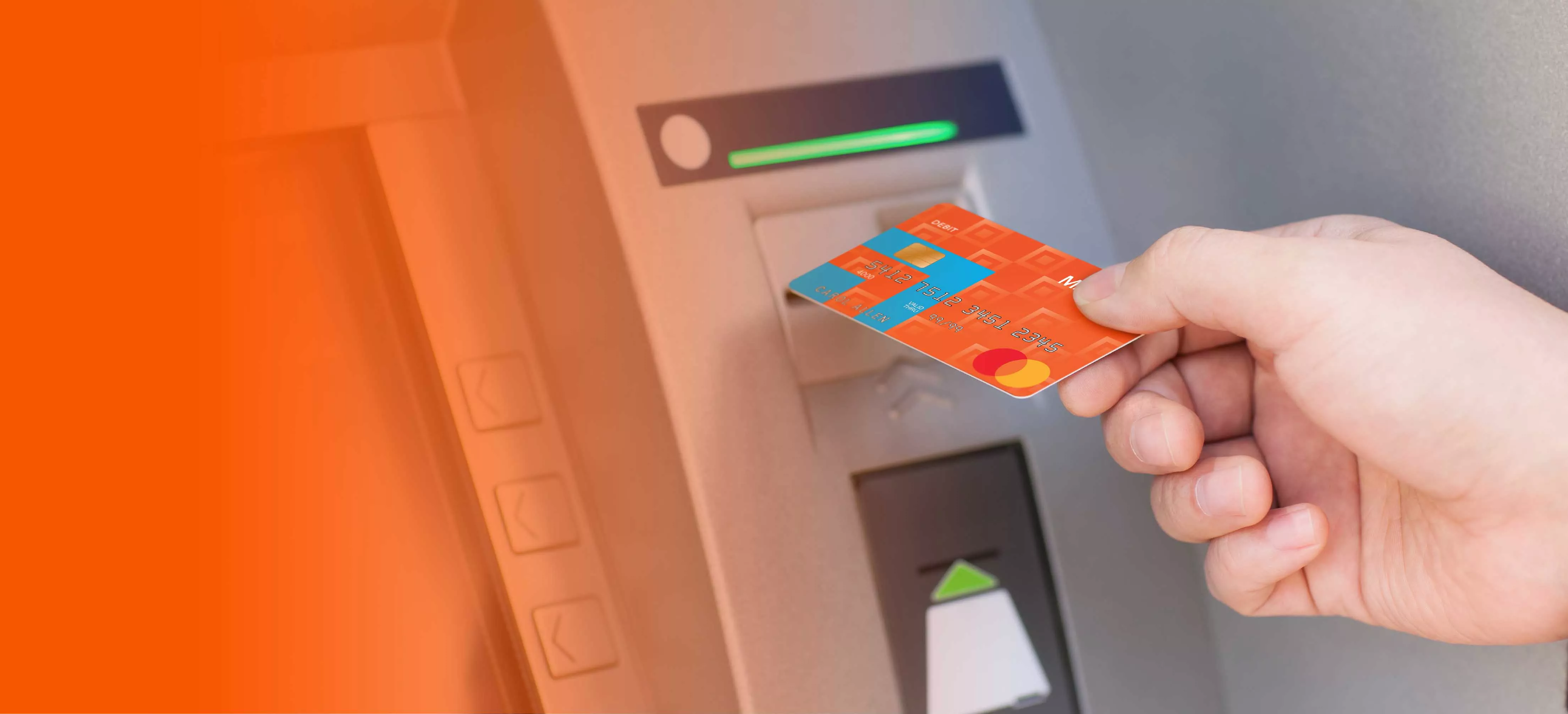 hand placing a midland card into the atm
